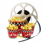 8916264-several-boxes-full-with-popcorn-and-movie-reel-isolated-over-white